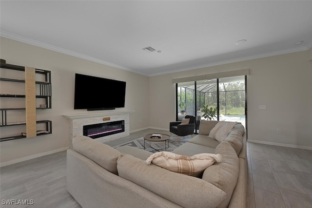 17573 Ashcomb Way, Estero, FL 33928 - living room with ornamental molding, a glass covered fireplace, and a sunroom