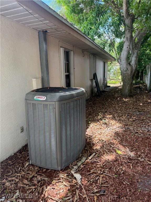 9973 Boca Ave N, Naples, FL 34109 - exterior view of a central AC unit and stucco siding