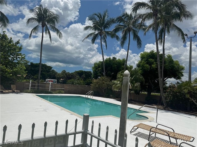 9973 Boca Ave N, Naples, FL 34109 - community pool featuring a patio area
