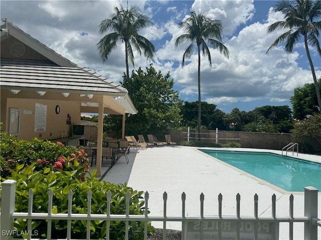 9973 Boca Ave N, Naples, FL 34109 - community pool featuring a patio