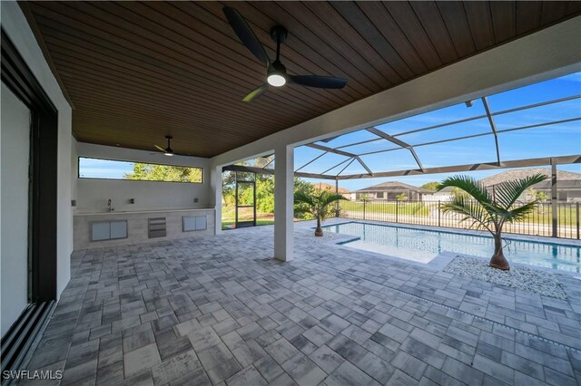 1502 SW 17th Ave, Cape Coral, FL 33991 - view of patio / terrace featuring area for grilling, a ceiling fan, and glass enclosure