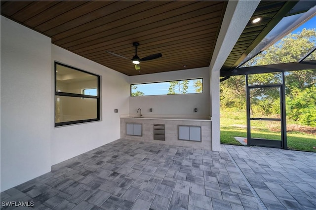 1502 SW 17th Ave, Cape Coral, FL 33991 - view of patio featuring an outdoor kitchen and a ceiling fan