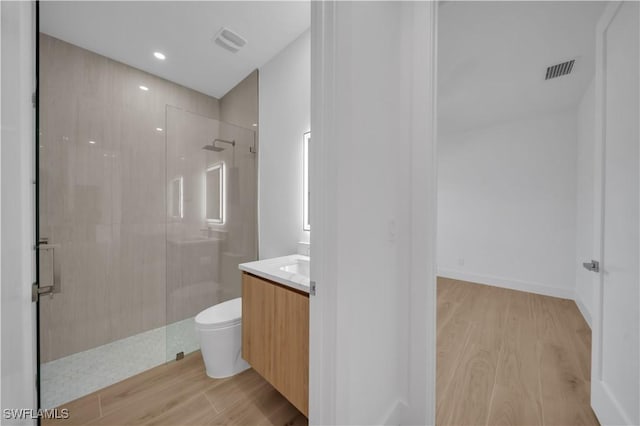 1502 SW 17th Ave, Cape Coral, FL 33991 - full bath featuring wood finished floors, a shower with door, vanity, and recessed lighting
