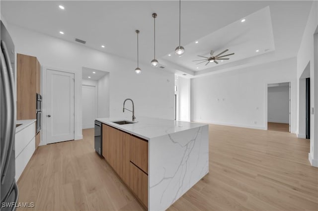 1502 SW 17th Ave, Cape Coral, FL 33991 - kitchen with modern cabinets, a spacious island, appliances with stainless steel finishes, light wood-style flooring, and recessed lighting