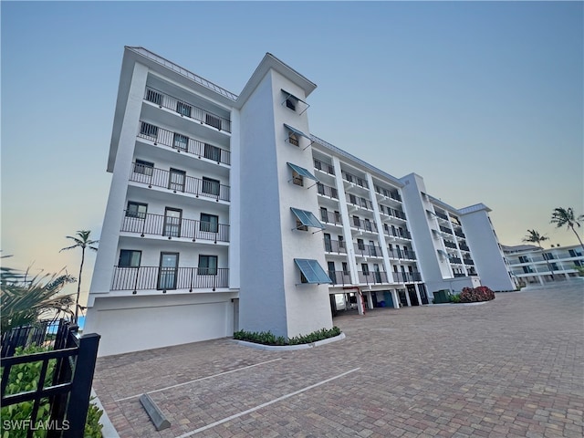 4770 Estero Blvd Unit 203, Fort Myers Beach, FL 33931 - property at dusk featuring a view of apartment building / complex