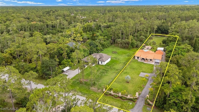3270 14th Ave NE, Naples, FL 34120 - aerial overview of property's location featuring a heavily wooded area and property parcel outlined