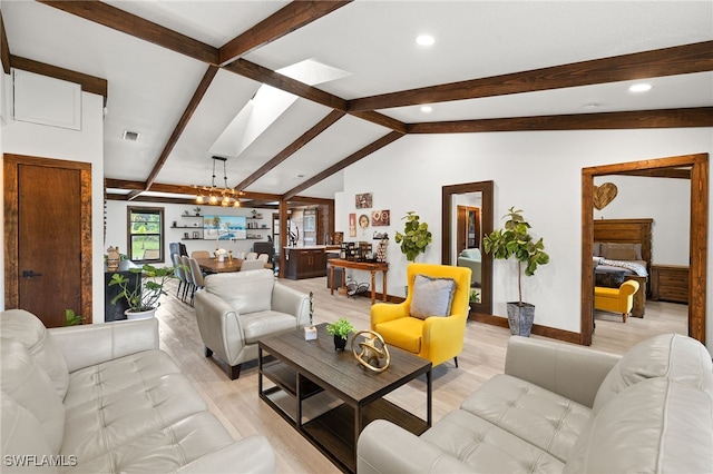 3270 14th Ave NE, Naples, FL 34120 - living room featuring light wood finished floors, recessed lighting, a chandelier, and a skylight