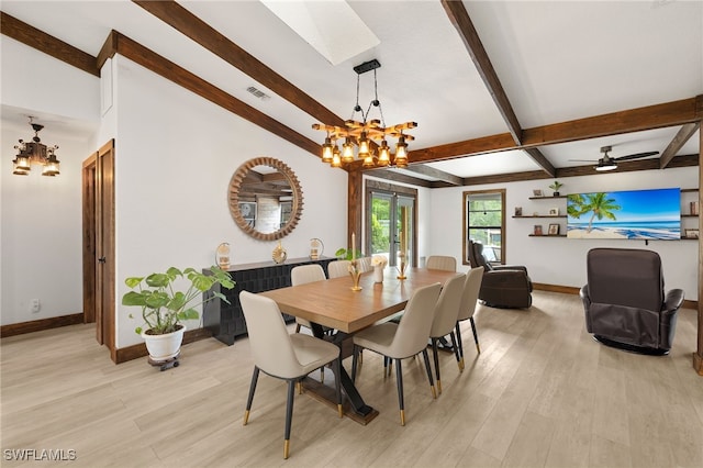 3270 14th Ave NE, Naples, FL 34120 - dining space featuring a chandelier, beam ceiling, light wood finished floors, and a skylight