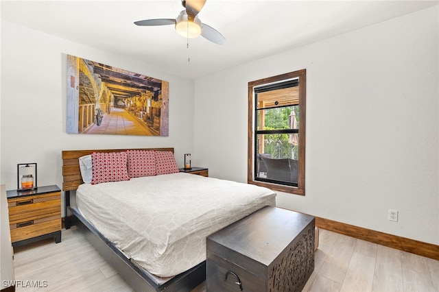 3270 14th Ave NE, Naples, FL 34120 - bedroom featuring light wood-type flooring and ceiling fan