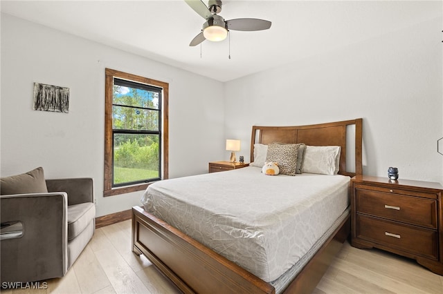 3270 14th Ave NE, Naples, FL 34120 - bedroom with light wood-type flooring and ceiling fan