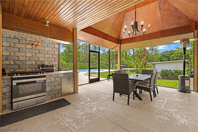 3270 14th Ave NE, Naples, FL 34120 - sunroom / solarium featuring a chandelier