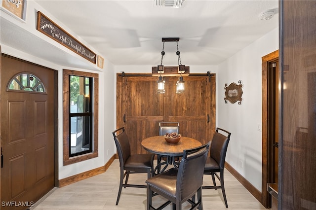 3270 14th Ave NE, Naples, FL 34120 - dining space with light wood-type flooring