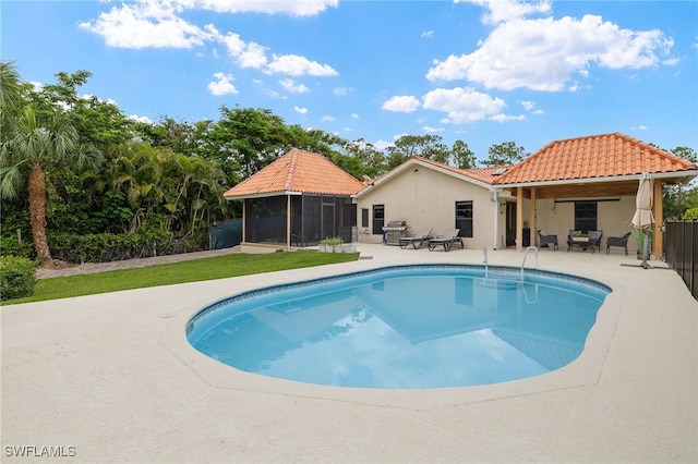 3270 14th Ave NE, Naples, FL 34120 - swimming pool featuring a sunroom and a patio