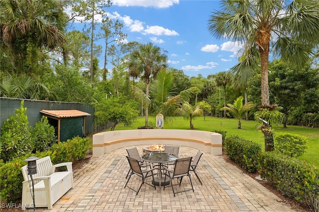3270 14th Ave NE, Naples, FL 34120 - view of patio / terrace featuring view of scattered trees and outdoor dining space