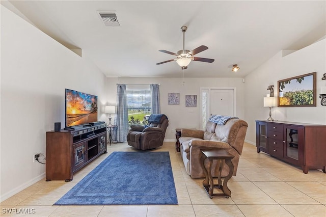 2619 42nd St SW, Lehigh Acres, FL 33976 - living room with ceiling fan, light tile patterned floors, and lofted ceiling