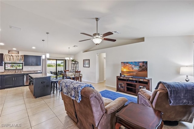 2619 42nd St SW, Lehigh Acres, FL 33976 - living room with light tile patterned floors, ceiling fan, recessed lighting, vaulted ceiling, and a chandelier