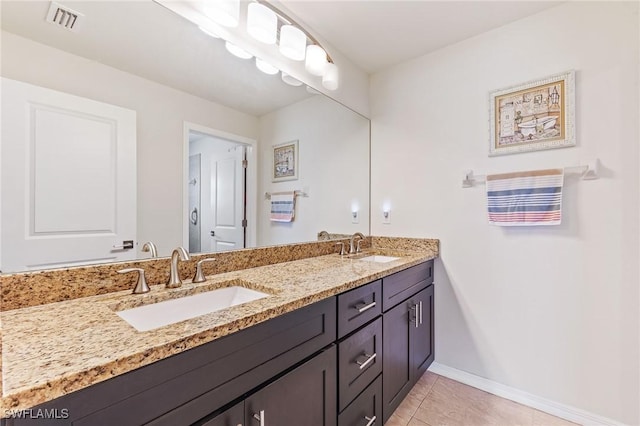 2619 42nd St SW, Lehigh Acres, FL 33976 - full bath with double vanity and tile patterned floors