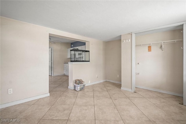 751 108th Ave N, Naples, FL 34108 - basement featuring a ceiling fan and light tile patterned floors
