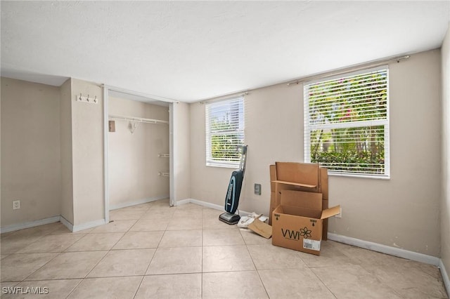 751 108th Ave N, Naples, FL 34108 - bedroom with a closet and light tile patterned floors