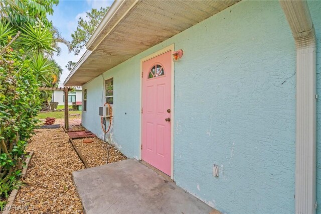 751 108th Ave N, Naples, FL 34108 - property entrance with stucco siding