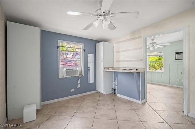 751 108th Ave N, Naples, FL 34108 - kitchen featuring cooling unit, light countertops, a ceiling fan, white cabinets, and light tile patterned floors
