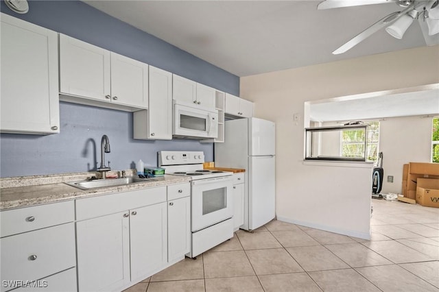 751 108th Ave N, Naples, FL 34108 - kitchen with white appliances, light countertops, white cabinetry, and a ceiling fan