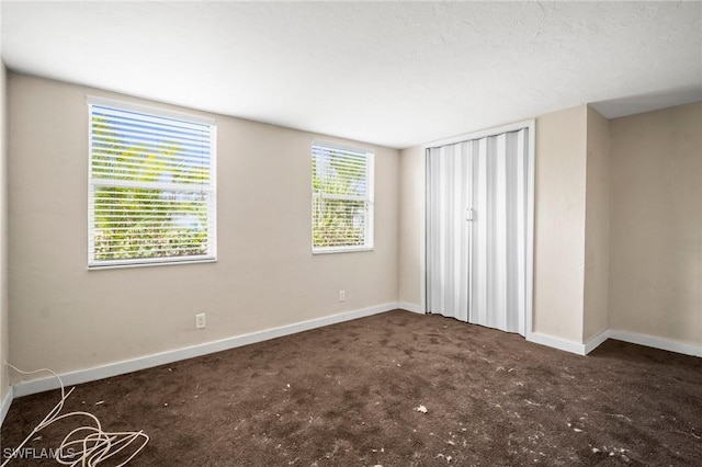 751 108th Ave N, Naples, FL 34108 - unfurnished bedroom featuring carpet floors and baseboards