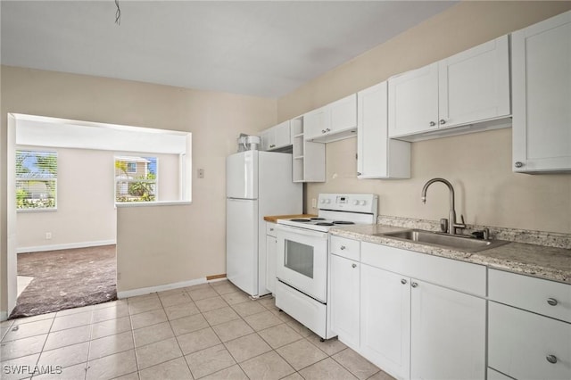 751 108th Ave N, Naples, FL 34108 - kitchen featuring white appliances, white cabinets, and light tile patterned floors