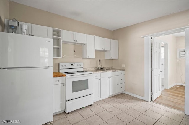 751 108th Ave N, Naples, FL 34108 - kitchen with white appliances, light countertops, white cabinetry, open shelves, and light tile patterned floors