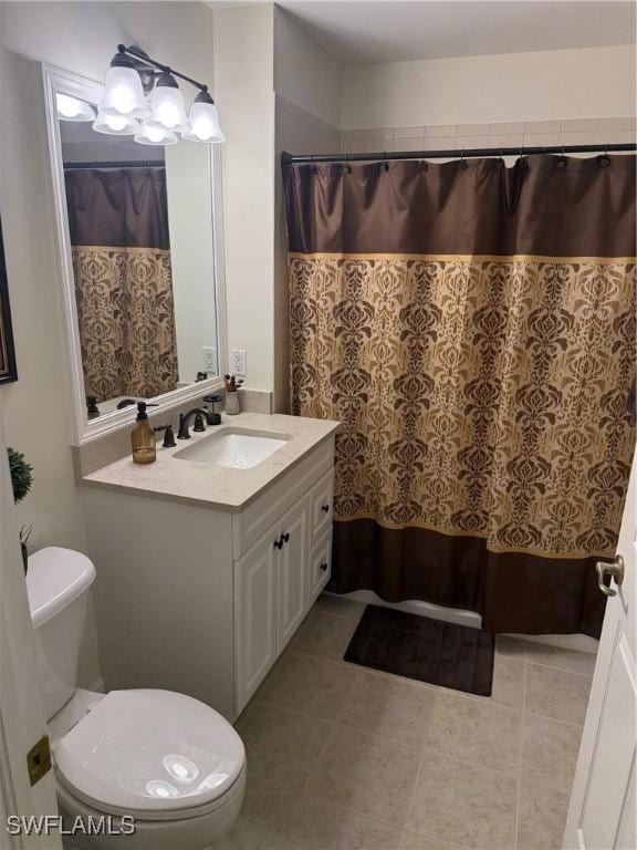 1520 SW 50th St Unit 101, Cape Coral, FL 33914 - bathroom featuring vanity, tile patterned flooring, and curtained shower