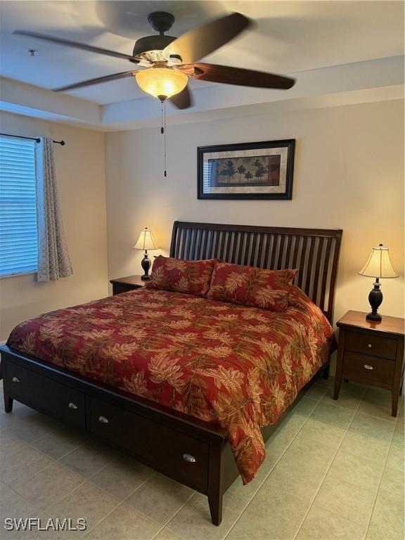 1520 SW 50th St Unit 101, Cape Coral, FL 33914 - bedroom with light tile patterned floors and a ceiling fan