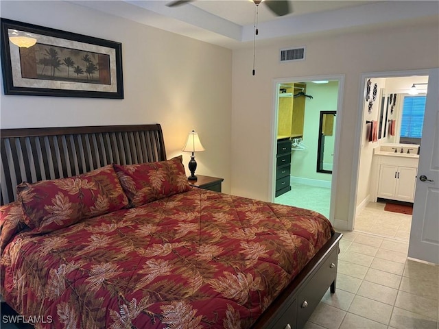 1520 SW 50th St Unit 101, Cape Coral, FL 33914 - tiled bedroom featuring connected bathroom and a sink