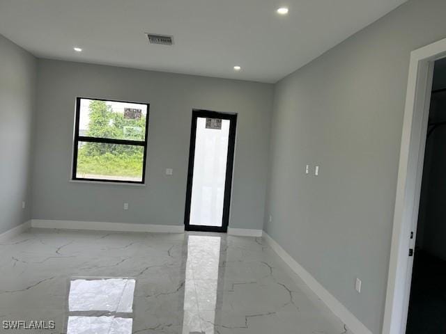3501 E 10th St, Lehigh Acres, FL 33972 - unfurnished room with recessed lighting and light marble finish floors