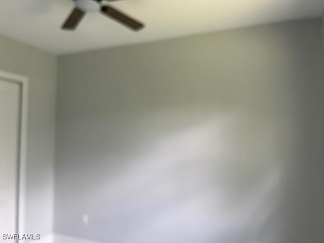 3501 E 10th St, Lehigh Acres, FL 33972 - empty room with ceiling fan