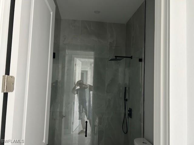 3501 E 10th St, Lehigh Acres, FL 33972 - bathroom with a marble finish shower and toilet