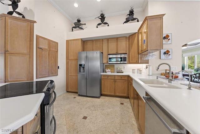 6120 Henderson Rd, Sanibel, FL 33957 - kitchen with appliances with stainless steel finishes, crown molding, a towering ceiling, light countertops, and brown cabinetry