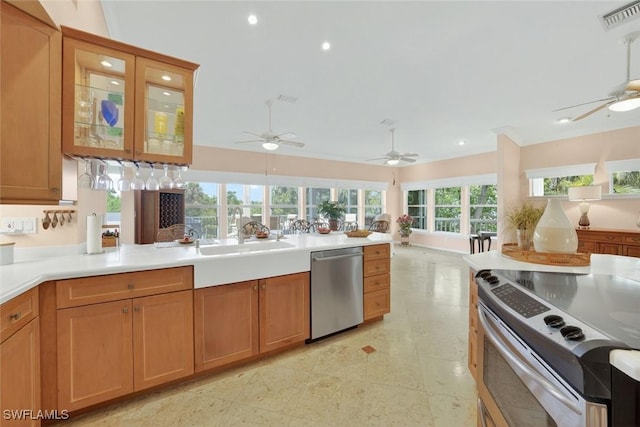 6120 Henderson Rd, Sanibel, FL 33957 - kitchen featuring stainless steel appliances, open floor plan, ceiling fan, recessed lighting, and light countertops