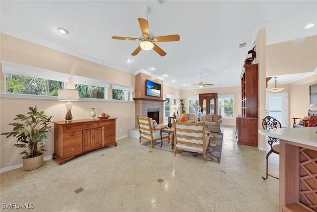 6120 Henderson Rd, Sanibel, FL 33957 - living room with ceiling fan, a tiled fireplace, recessed lighting, and crown molding