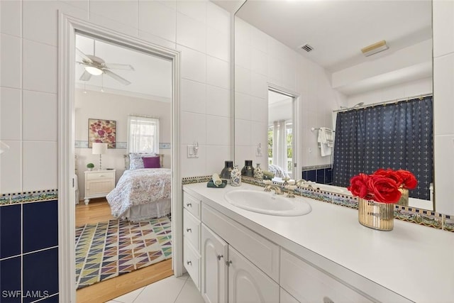 6120 Henderson Rd, Sanibel, FL 33957 - bathroom featuring ensuite bath, vanity, plenty of natural light, and a ceiling fan