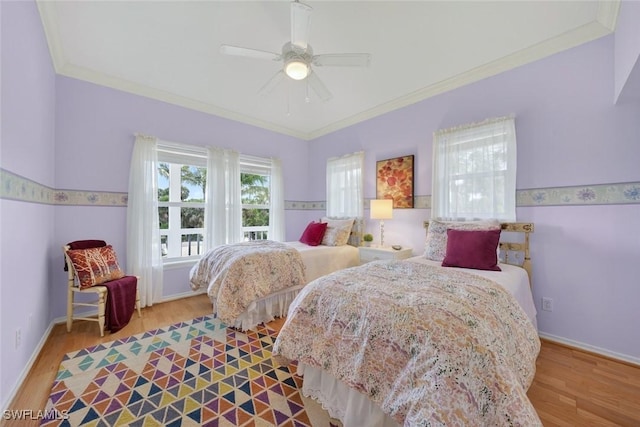 6120 Henderson Rd, Sanibel, FL 33957 - bedroom featuring wood finished floors, ornamental molding, and a ceiling fan