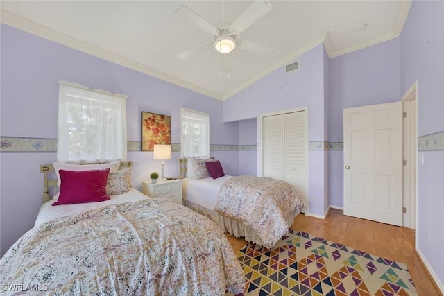 6120 Henderson Rd, Sanibel, FL 33957 - bedroom with ornamental molding, wood finished floors, a closet, lofted ceiling, and ceiling fan