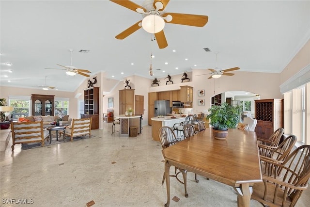 6120 Henderson Rd, Sanibel, FL 33957 - dining space featuring a ceiling fan, arched walkways, ornamental molding, high vaulted ceiling, and recessed lighting