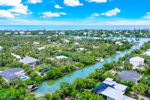 6120 Henderson Rd, Sanibel, FL 33957 - aerial perspective of suburban area with a large body of water