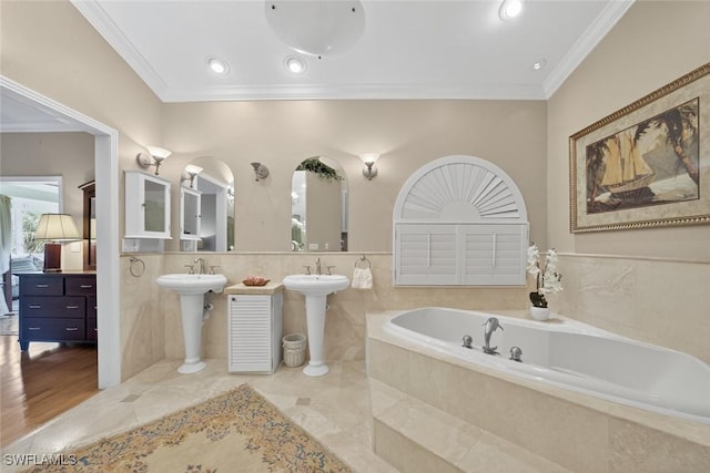 6120 Henderson Rd, Sanibel, FL 33957 - full bath with a bath, crown molding, tile walls, two sinks, and recessed lighting