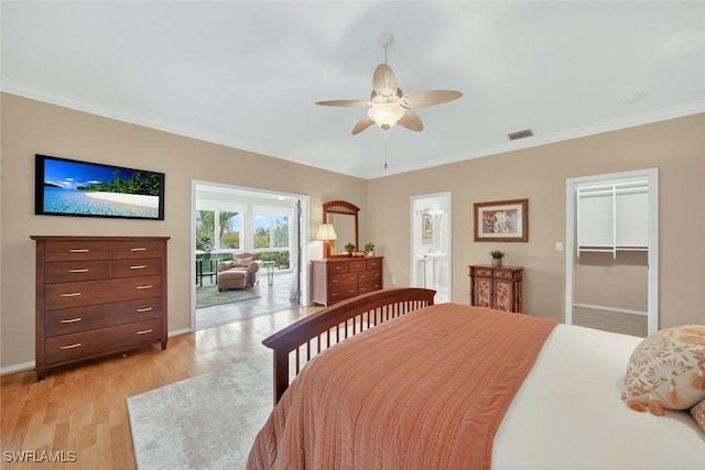 6120 Henderson Rd, Sanibel, FL 33957 - bedroom with light wood-style floors, crown molding, a ceiling fan, ensuite bathroom, and a spacious closet