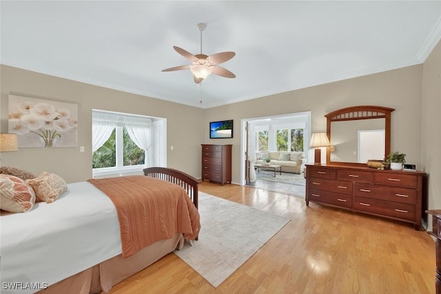 6120 Henderson Rd, Sanibel, FL 33957 - bedroom with light wood-type flooring, ornamental molding, and ceiling fan