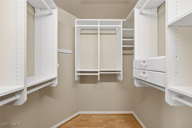 6120 Henderson Rd, Sanibel, FL 33957 - spacious closet featuring wood finished floors