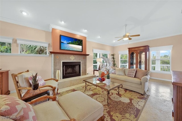 6120 Henderson Rd, Sanibel, FL 33957 - living room with a ceiling fan, crown molding, a tiled fireplace, and recessed lighting