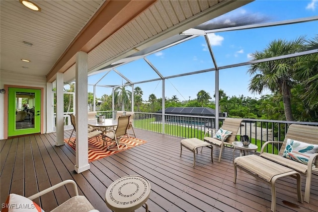 6120 Henderson Rd, Sanibel, FL 33957 - deck featuring outdoor dining area and glass enclosure