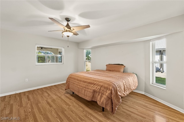 19897 Midway Blvd, Port Charlotte, FL 33948 - bedroom featuring wood finished floors and a ceiling fan